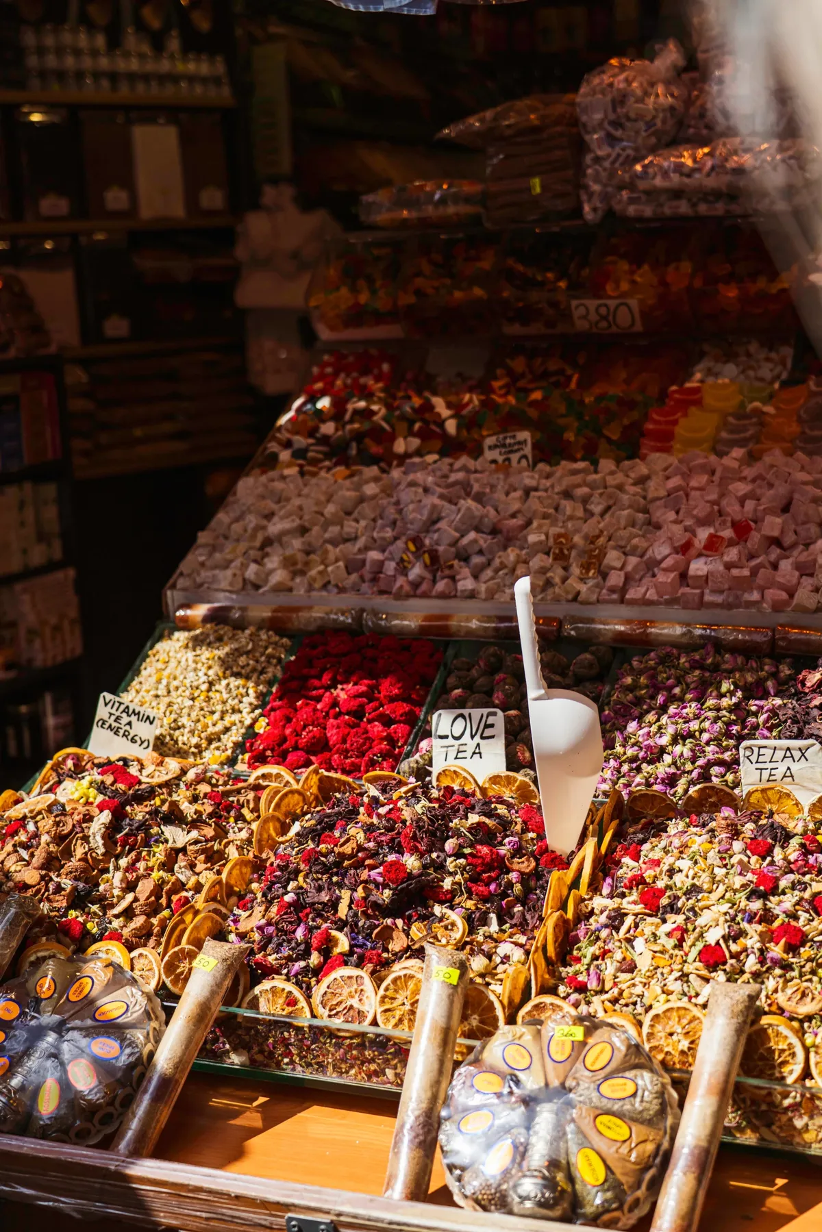 Trays of Turkish delight, dried fruit, herbal teas and dried flowers on display at a market stall in Istanbul.