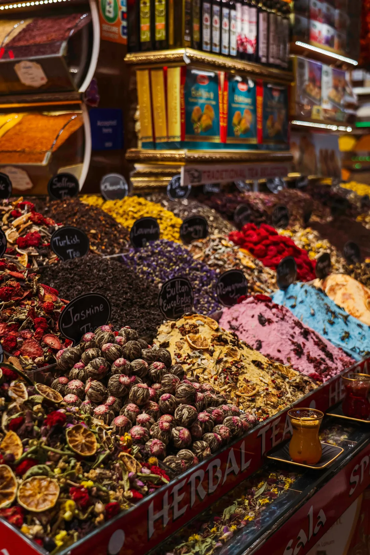 Mounds of loose herbal teas, dried flowers and fruit slices at a bazaar stall in Istanbul.